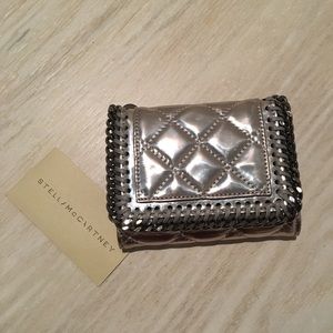 Stella McCartney metallic silver color wallet.